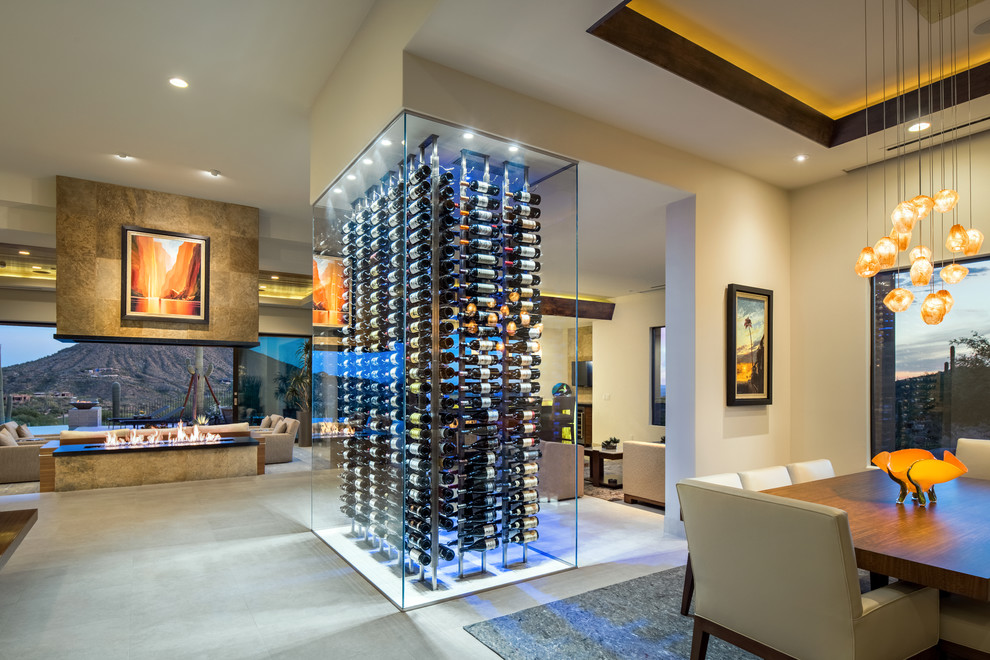 Mid-sized contemporary wine cellar in Phoenix with display racks and grey floor.