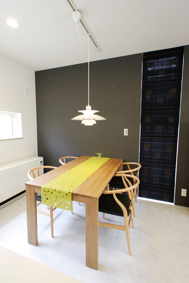 Mid-sized modern open plan dining in Other with black walls, linoleum floors and white floor.
