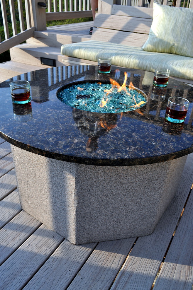 Mid-sized transitional backyard deck photo with a roof extension