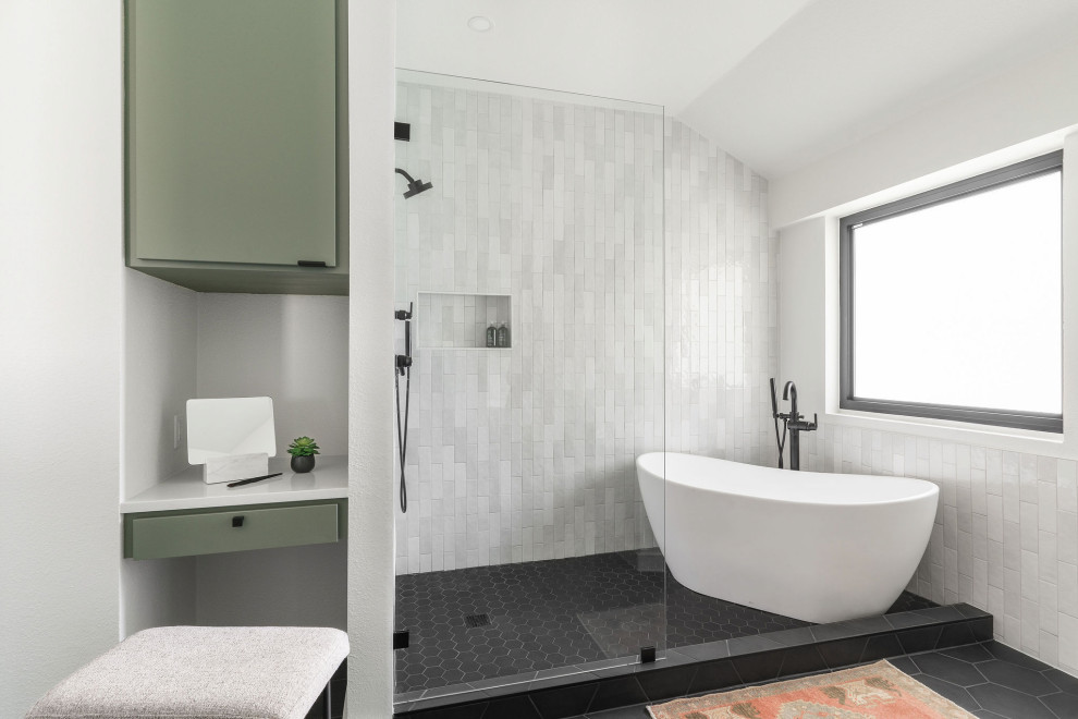 Large modern master bathroom in Austin with flat-panel cabinets, green cabinets, a freestanding tub, white tile, ceramic tile, white walls, ceramic floors, a drop-in sink, engineered quartz benchtops, black floor, an open shower, white benchtops, a niche, a double vanity and a built-in vanity.