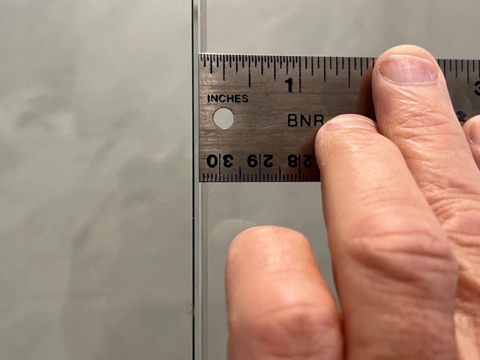 Frameless shower door gap