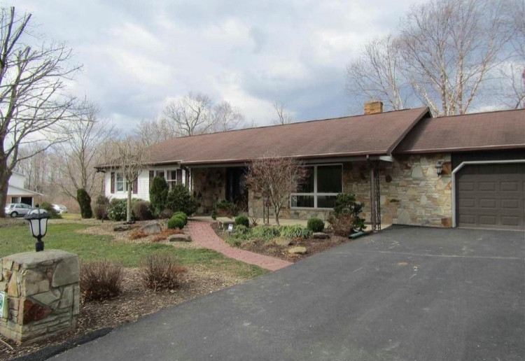 Can you paint stone veneer to update the exterior of this 1970’s home?