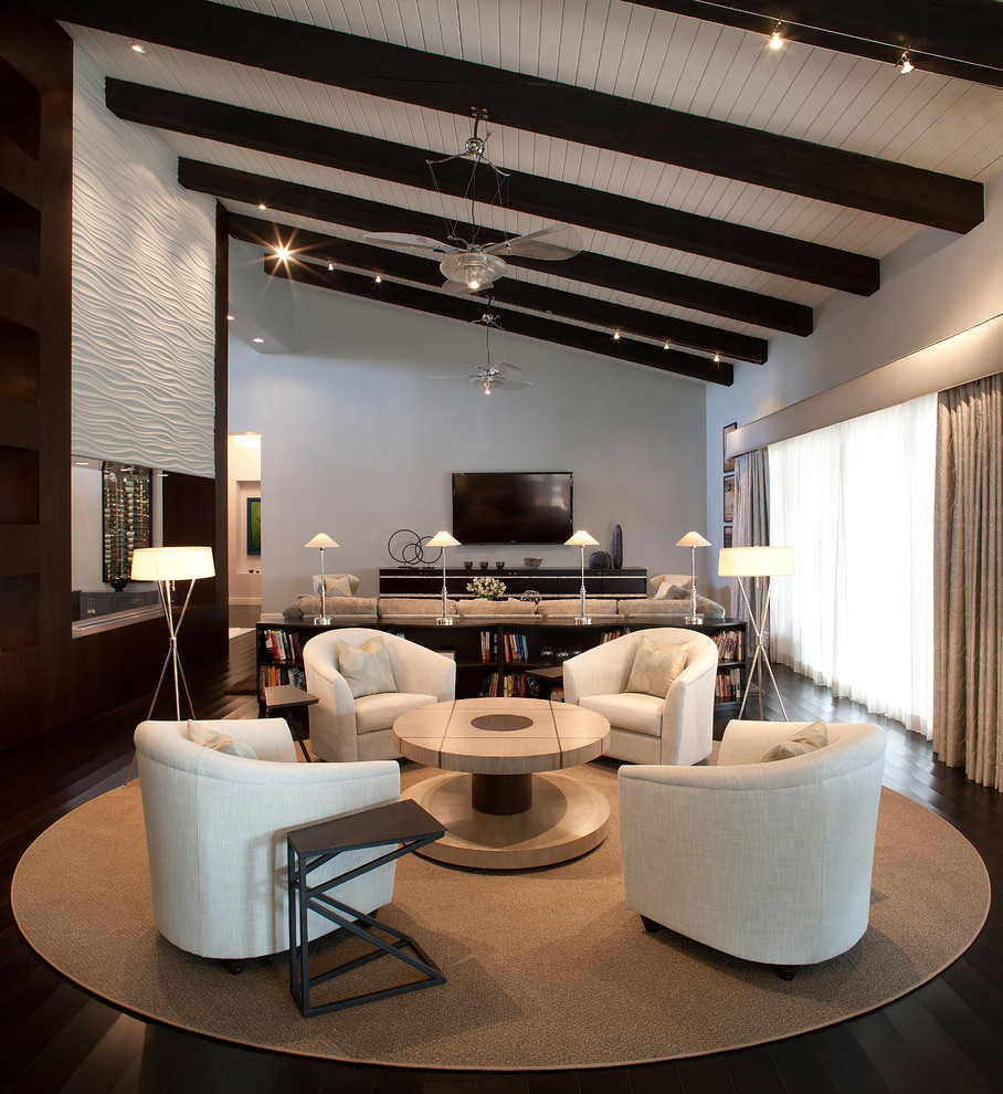 Large contemporary open concept living room in Phoenix with grey walls, a wall-mounted tv, a home bar and dark hardwood floors.