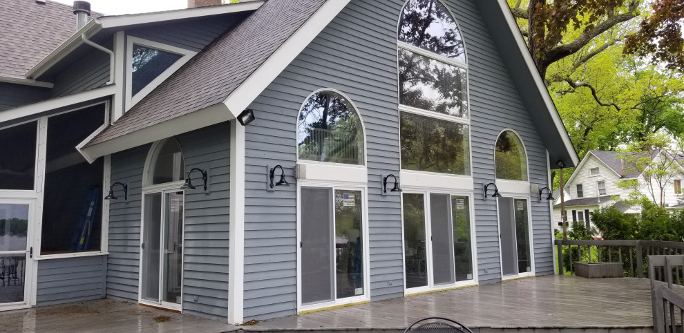Custom vinyl sliding glass doors in lake house installed