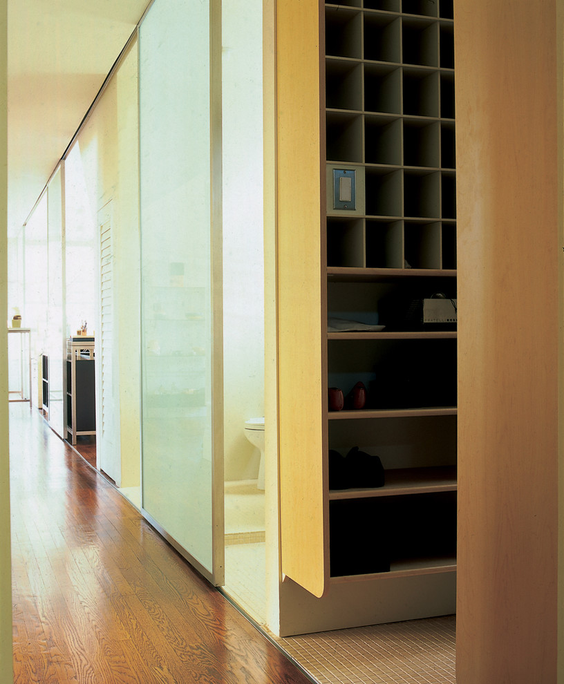 This is an example of a modern hallway in San Francisco with dark hardwood floors.