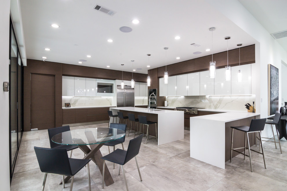 Photo of a large contemporary u-shaped open plan kitchen in Dallas with an undermount sink, glass-front cabinets, dark wood cabinets, quartz benchtops, white splashback, stone slab splashback, stainless steel appliances, porcelain floors and multiple islands.