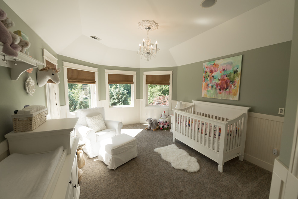This is an example of a large transitional gender-neutral nursery in Portland with white walls, carpet and beige floor.