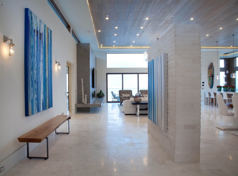 Inspiration for a large contemporary hallway in San Diego with beige walls, porcelain floors and beige floor.
