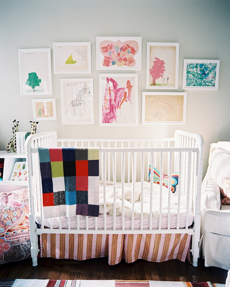 Inspiration for a transitional gender-neutral nursery in Los Angeles with white walls and dark hardwood floors.