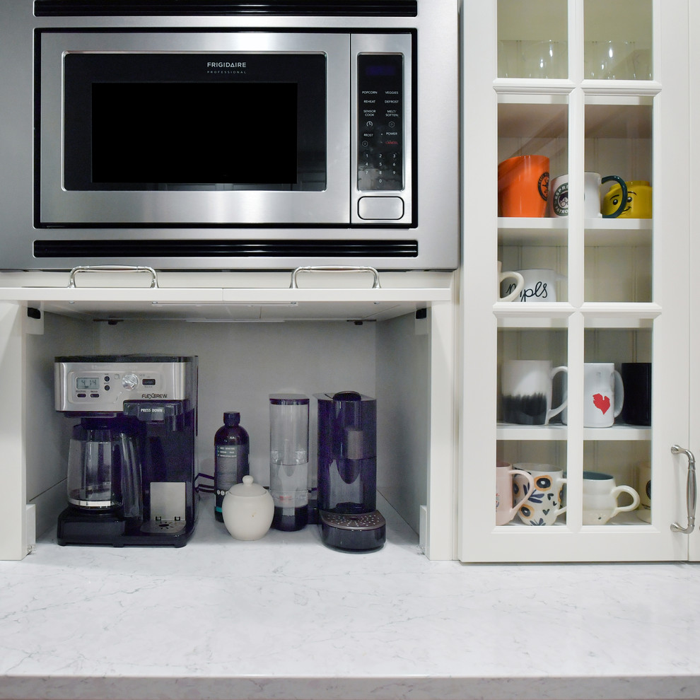 Inspiration for a large transitional u-shaped porcelain tile and orange floor eat-in kitchen remodel with a double-bowl sink, recessed-panel cabinets, white cabinets, quartz countertops, blue backsplash, subway tile backsplash, stainless steel appliances, an island and gray countertops