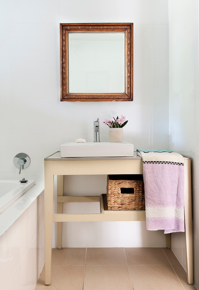 Design ideas for a small beach style bathroom in Sydney with a vessel sink, laminate benchtops, a drop-in tub, white tile, ceramic tile and porcelain floors.