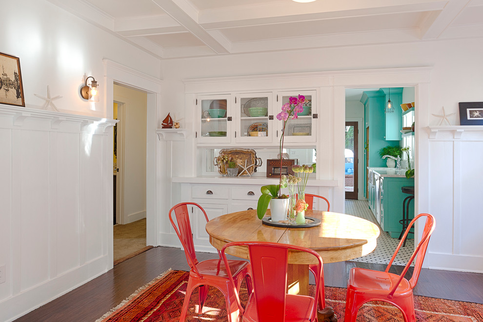 Mid-sized arts and crafts separate dining room in Other with white walls and medium hardwood floors.