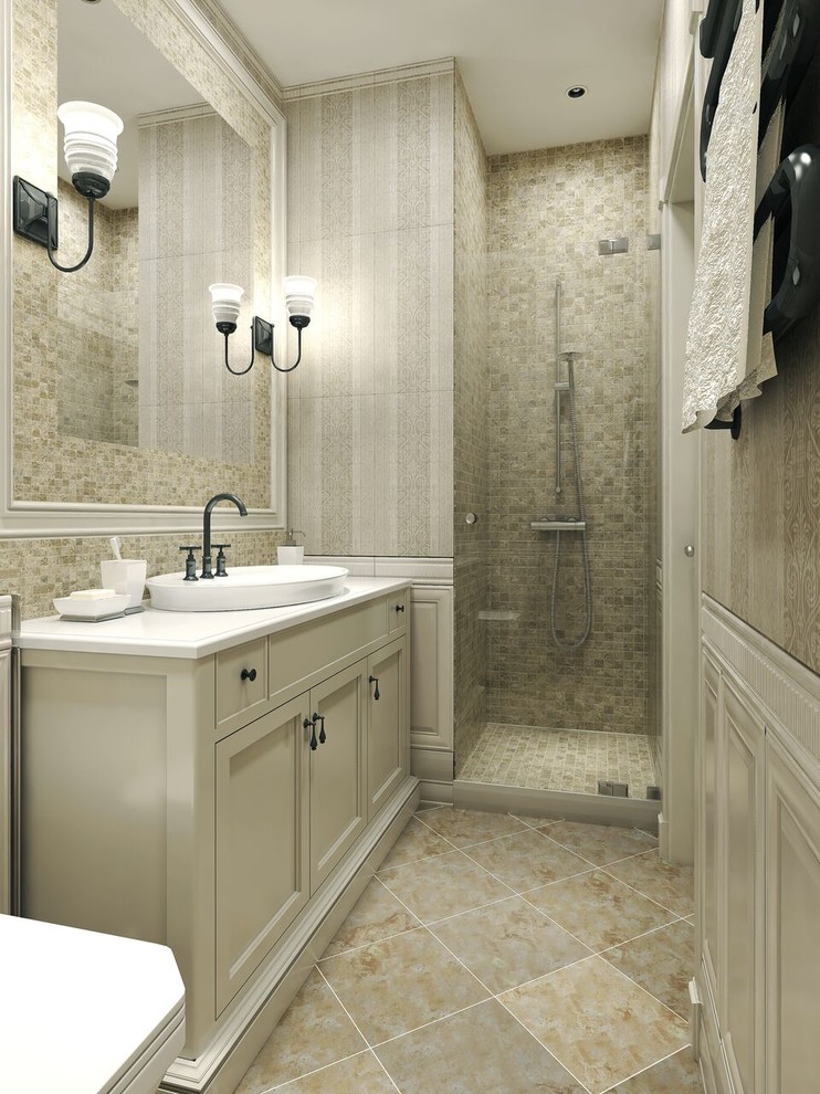 Alcove shower - mid-sized transitional 3/4 mosaic tile limestone floor alcove shower idea in Denver with shaker cabinets, white cabinets, a one-piece toilet, a vessel sink and solid surface countertops