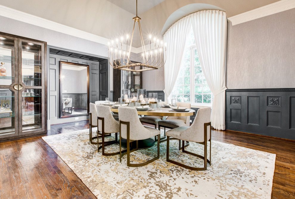 This is an example of a transitional separate dining room in Dallas with grey walls, dark hardwood floors, brown floor, decorative wall panelling and wallpaper.