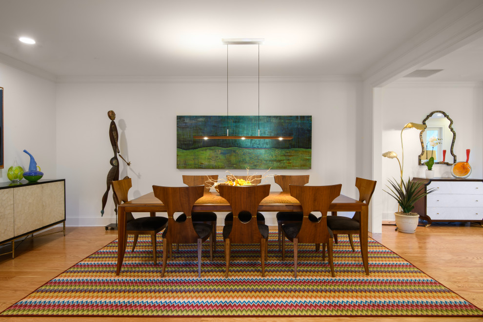 Inspiration for a large contemporary dining room in Philadelphia with white walls, medium hardwood floors and brown floor.