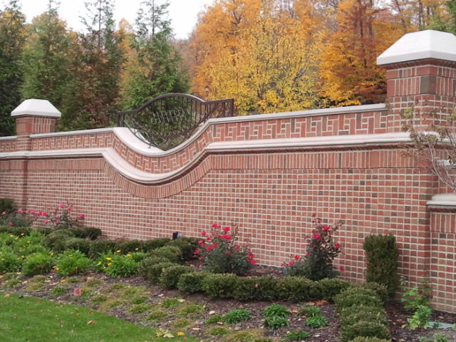 Design ideas for an expansive traditional two-storey brick red exterior in Cleveland.