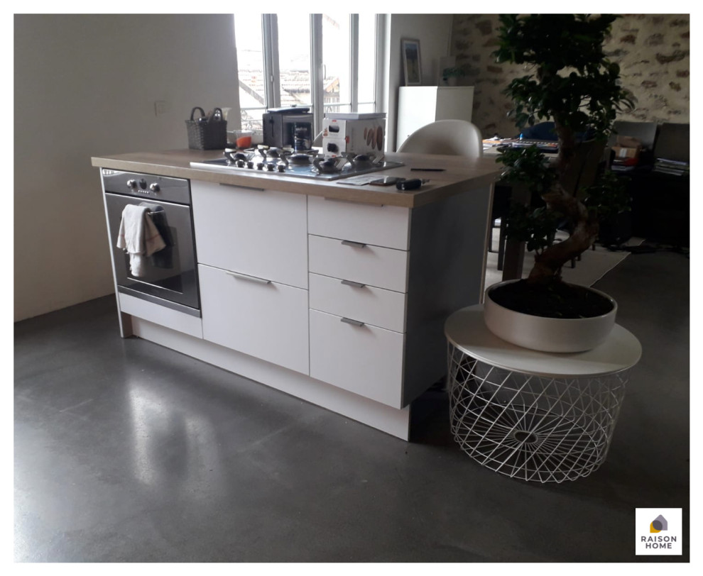 Design ideas for a small scandinavian galley open plan kitchen in Paris with an undermount sink, flat-panel cabinets, stainless steel cabinets, wood benchtops, brown splashback, timber splashback, stainless steel appliances, concrete floors, with island, grey floor, brown benchtop and wallpaper.