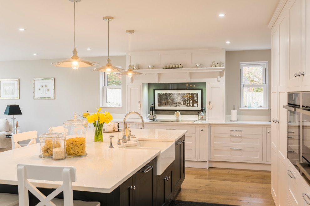 Expansive contemporary kitchen in Berkshire with a double-bowl sink and with island.