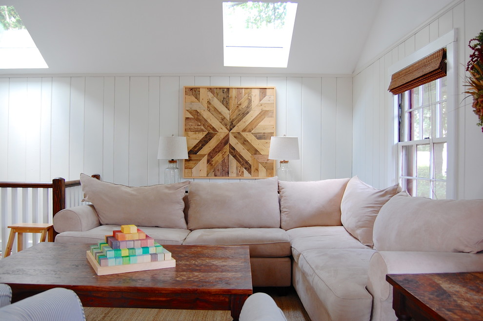 Photo of a small country family room in New York with white walls.