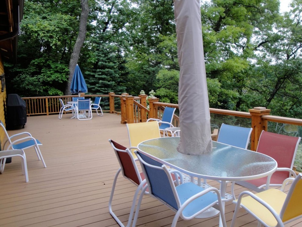 Inspiration for a large rustic backyard balcony deck remodel in Detroit with no cover