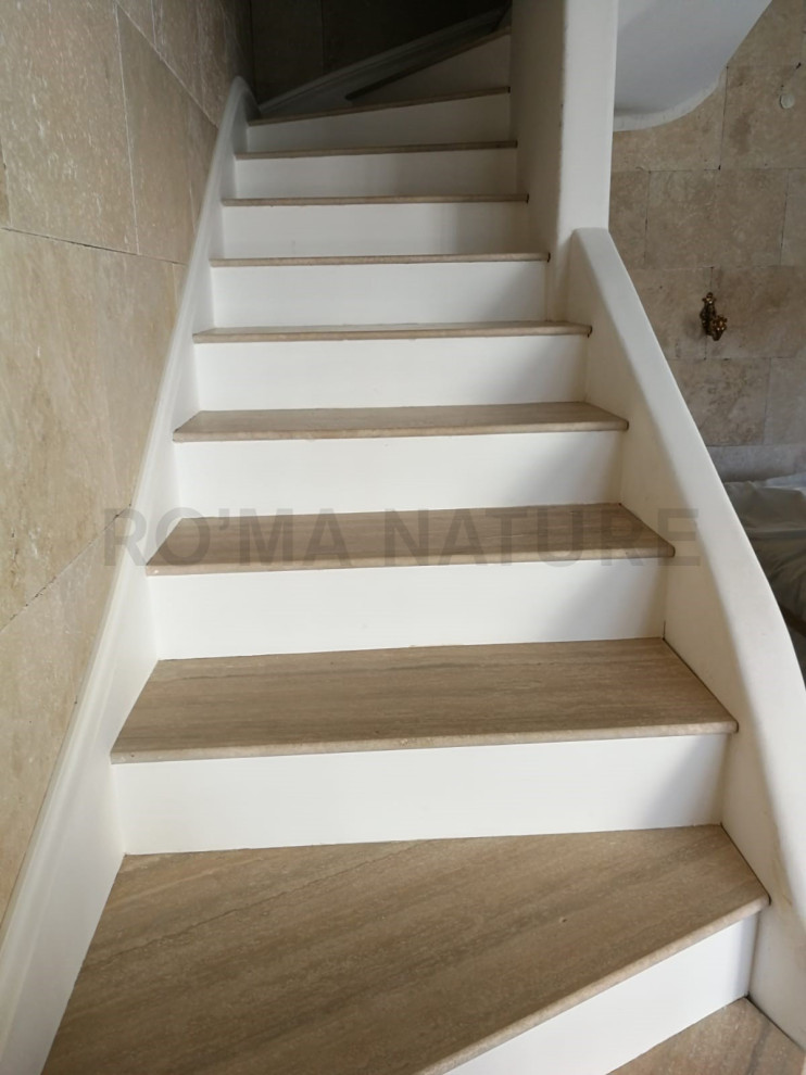 This is an example of a traditional travertine l-shaped staircase in Dijon.