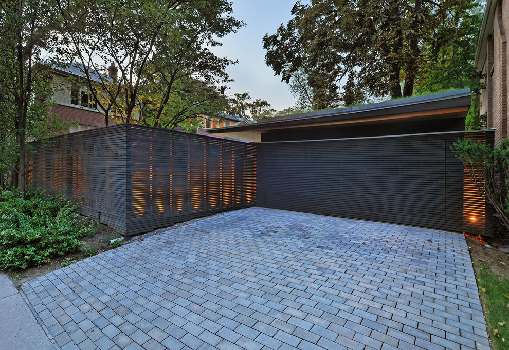 Inspiration for a mid-sized modern two-car garage in Toronto.