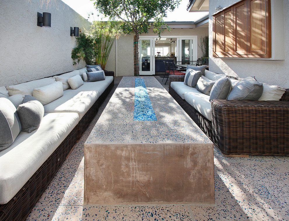 Inspiration for a transitional patio in Orange County with a fire feature.