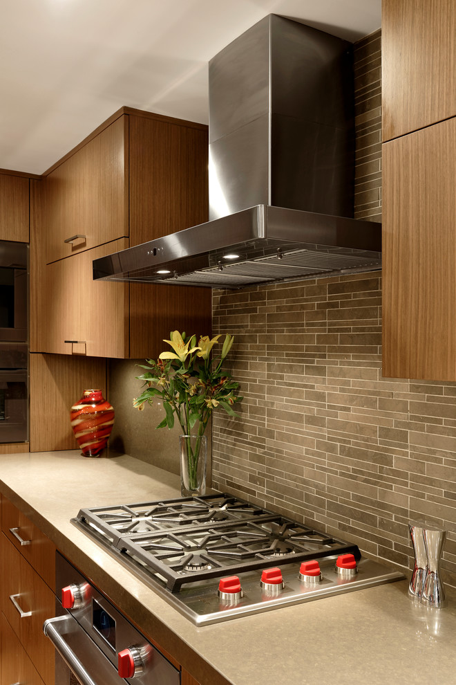 Design ideas for a mid-sized contemporary u-shaped eat-in kitchen in DC Metro with an integrated sink, flat-panel cabinets, medium wood cabinets, quartz benchtops, grey splashback, stone tile splashback, panelled appliances, medium hardwood floors and with island.