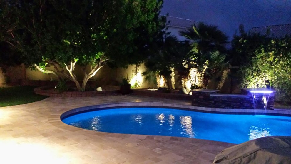 Pool fountain - mid-sized traditional backyard tile and custom-shaped lap pool fountain idea in Phoenix