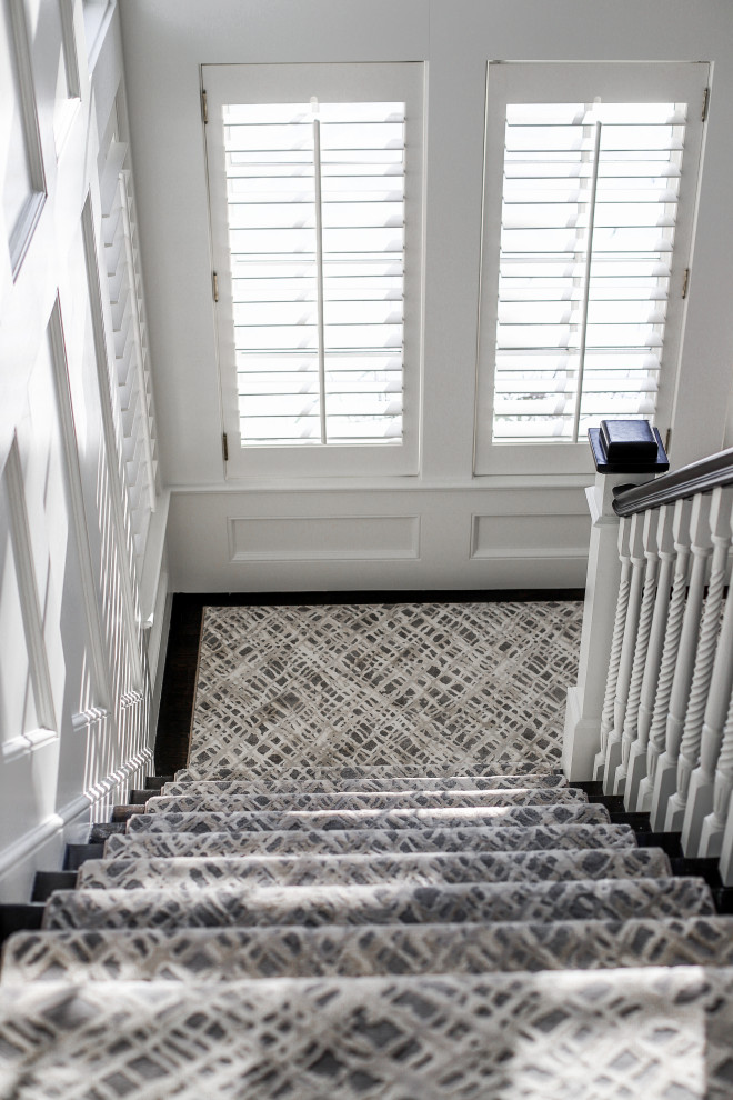 Design ideas for a large contemporary carpeted staircase in Boston.