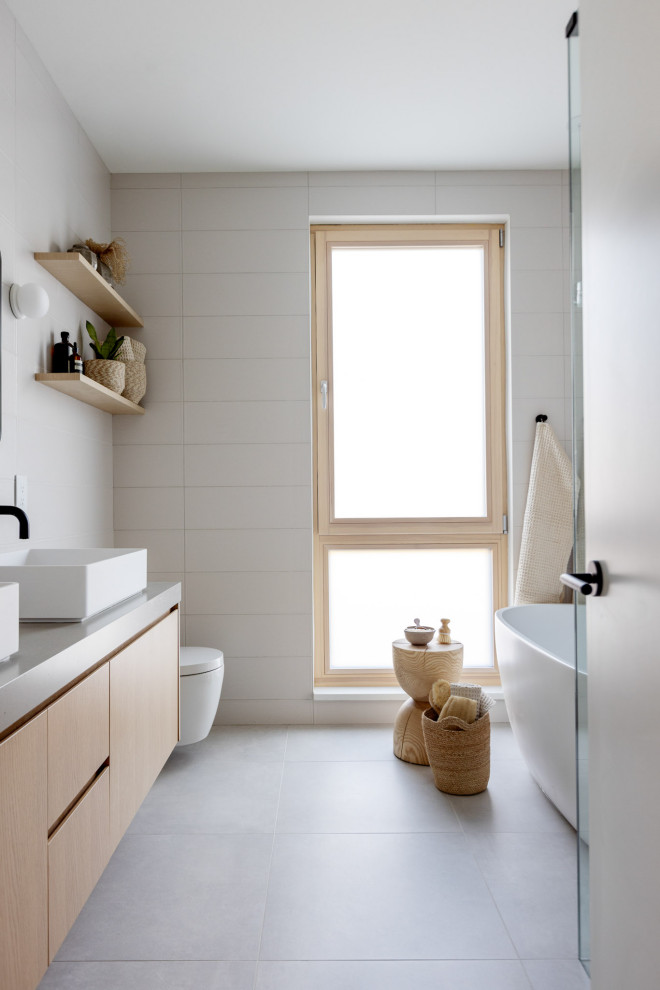 Mid-sized scandinavian master bathroom in Vancouver with flat-panel cabinets, brown cabinets, a one-piece toilet, beige tile, subway tile, beige walls, a vessel sink, engineered quartz benchtops, brown benchtops, a double vanity and a floating vanity.