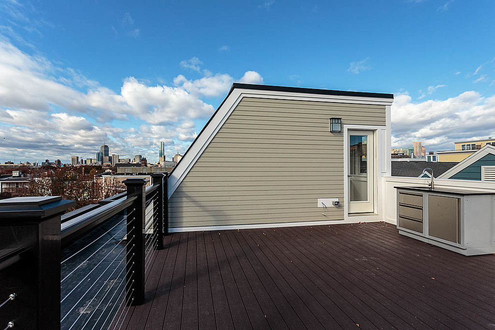 Large modern rooftop deck in Boston with an outdoor kitchen and no cover.