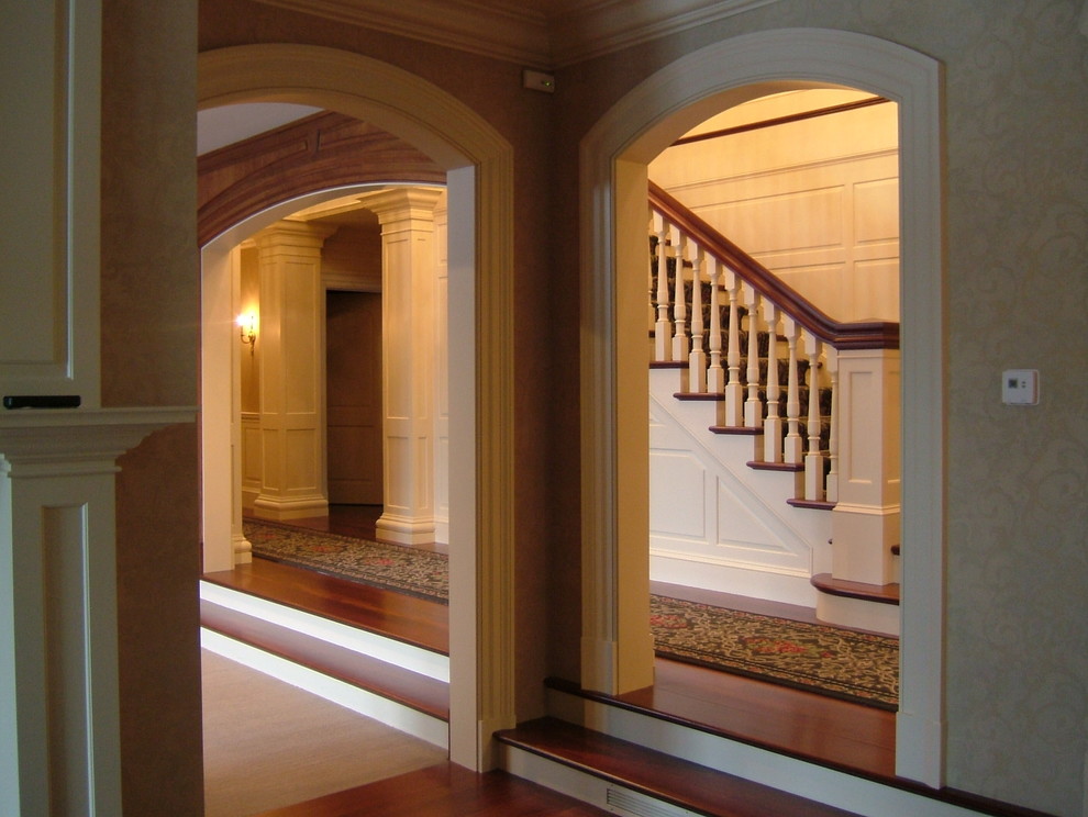 Design ideas for a mid-sized traditional wood straight staircase in Boston with painted wood risers.