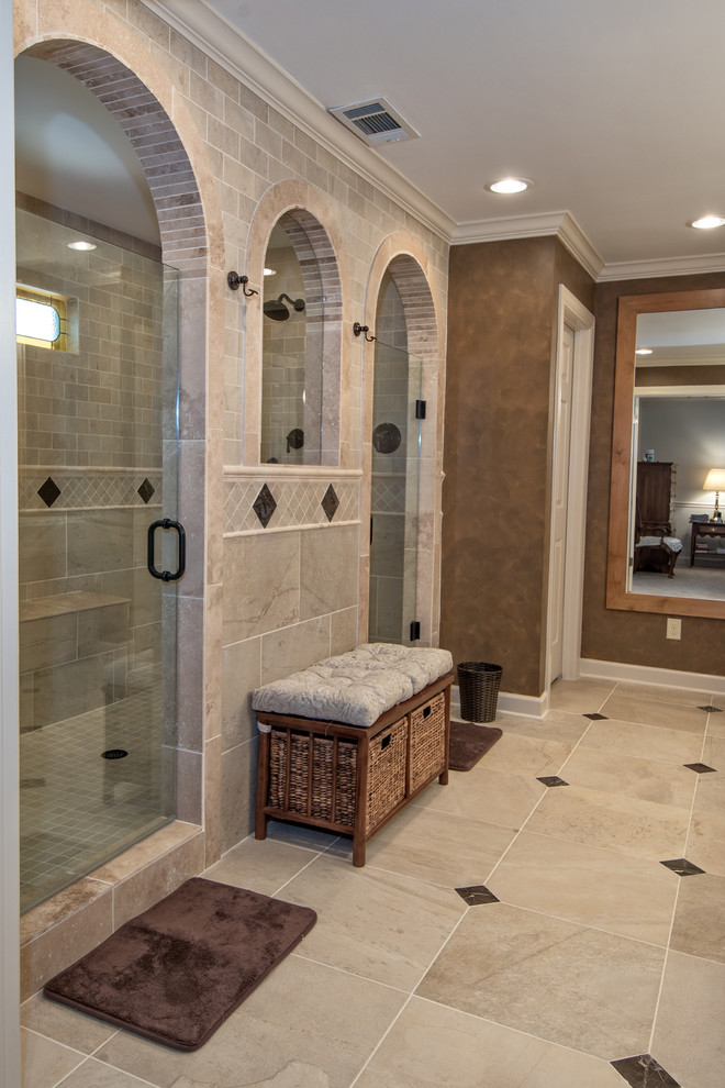 Design ideas for a mid-sized traditional master bathroom in Other with granite benchtops, raised-panel cabinets, light wood cabinets, a double shower, a wall-mount toilet, beige tile, porcelain tile, brown walls, porcelain floors and an undermount sink.