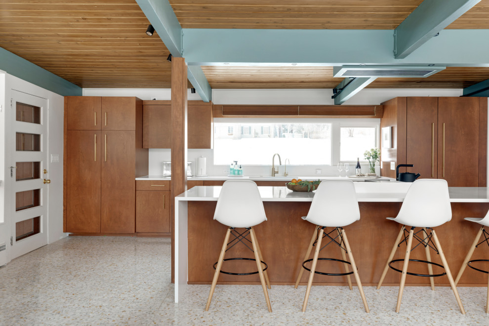 Inspiration for a mid-sized midcentury eat-in kitchen in Minneapolis with an undermount sink, flat-panel cabinets, brown cabinets, quartz benchtops, white splashback, engineered quartz splashback, panelled appliances, terrazzo floors, with island, white floor, white benchtop and exposed beam.