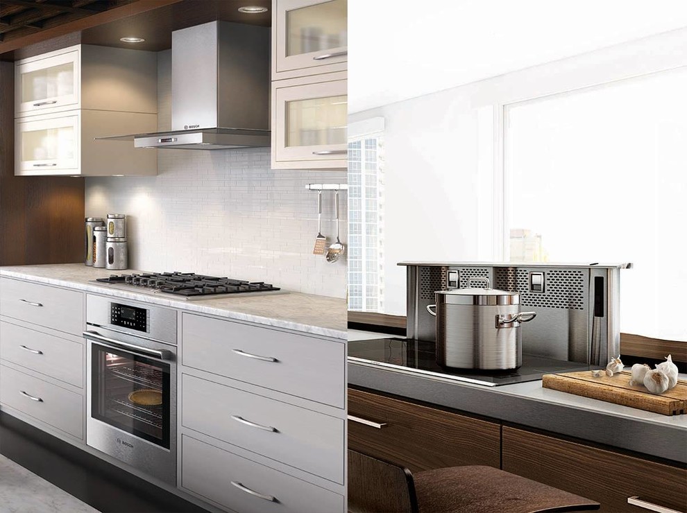Minimalist single-wall ceramic tile kitchen photo in Houston with flat-panel cabinets, gray cabinets, solid surface countertops, white backsplash, ceramic backsplash and stainless steel appliances