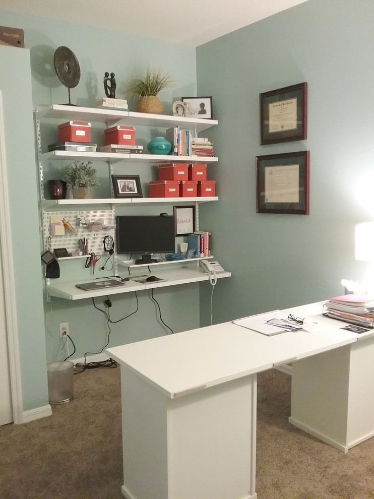 Design ideas for a mid-sized traditional home office in Tampa with grey walls, carpet, no fireplace, a freestanding desk and beige floor.