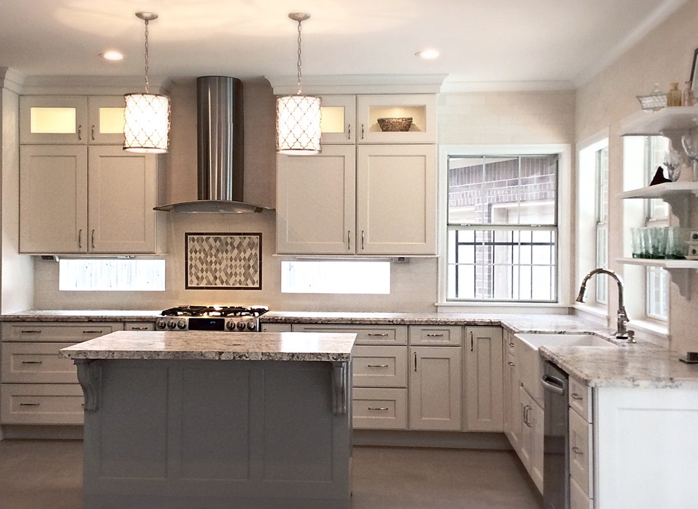 Inspiration for a mid-sized transitional u-shaped ceramic tile eat-in kitchen remodel in Houston with a farmhouse sink, recessed-panel cabinets, white cabinets, granite countertops, white backsplash, stone tile backsplash, stainless steel appliances and an island