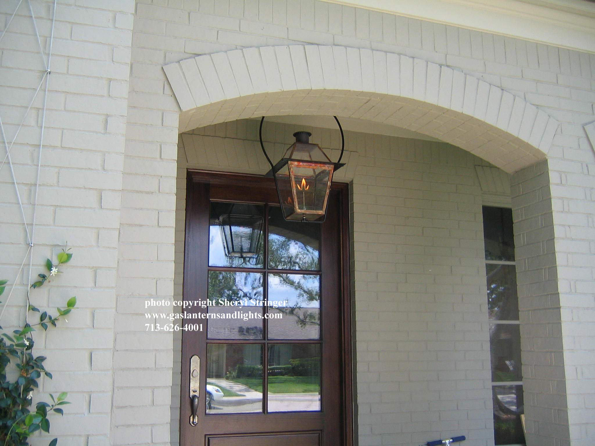Sheryl's New Orleans Style Gas Lantern with Glass Top Hanging by Steel Yoke