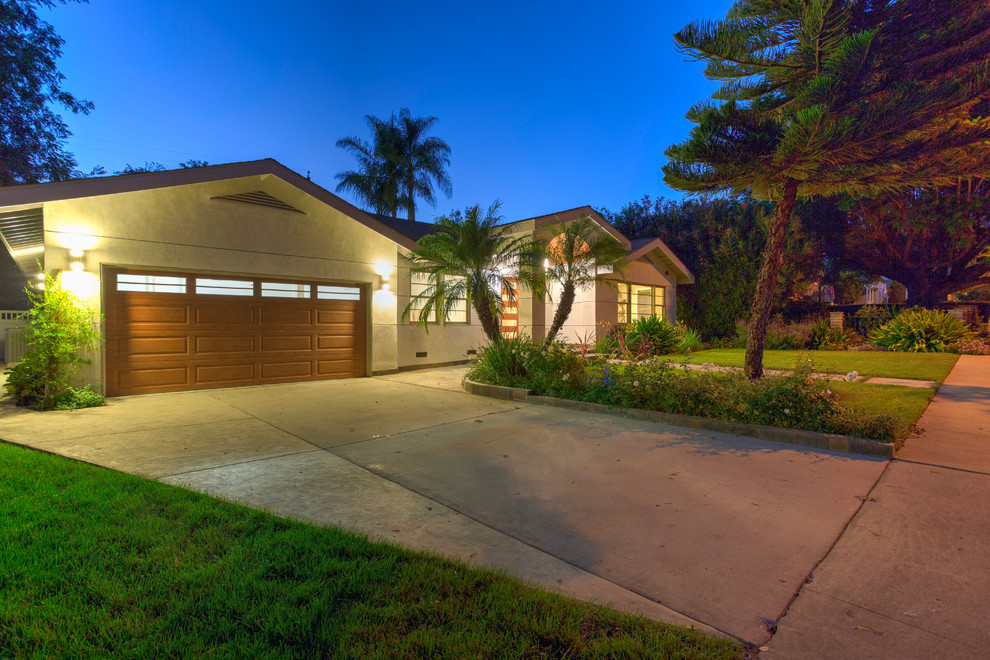 Photo of a mid-sized modern attached two-car garage in Los Angeles.