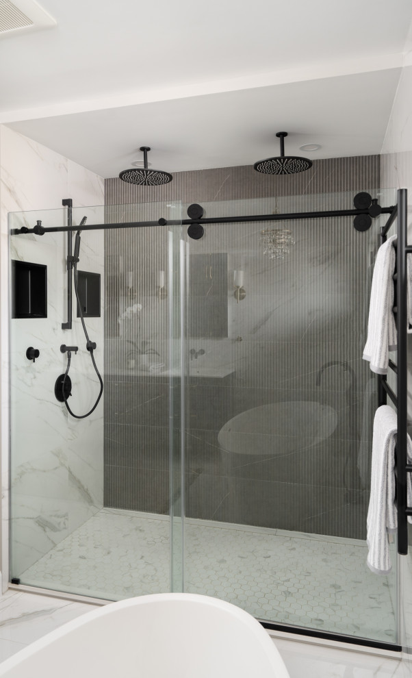 This is an example of a large contemporary ensuite bathroom in Montreal with raised-panel cabinets, blue cabinets, a freestanding bath, an alcove shower, a one-piece toilet, white tiles, porcelain tiles, white walls, porcelain flooring, an integrated sink, solid surface worktops, white floors, a sliding door, white worktops, an enclosed toilet, double sinks and a floating vanity unit.