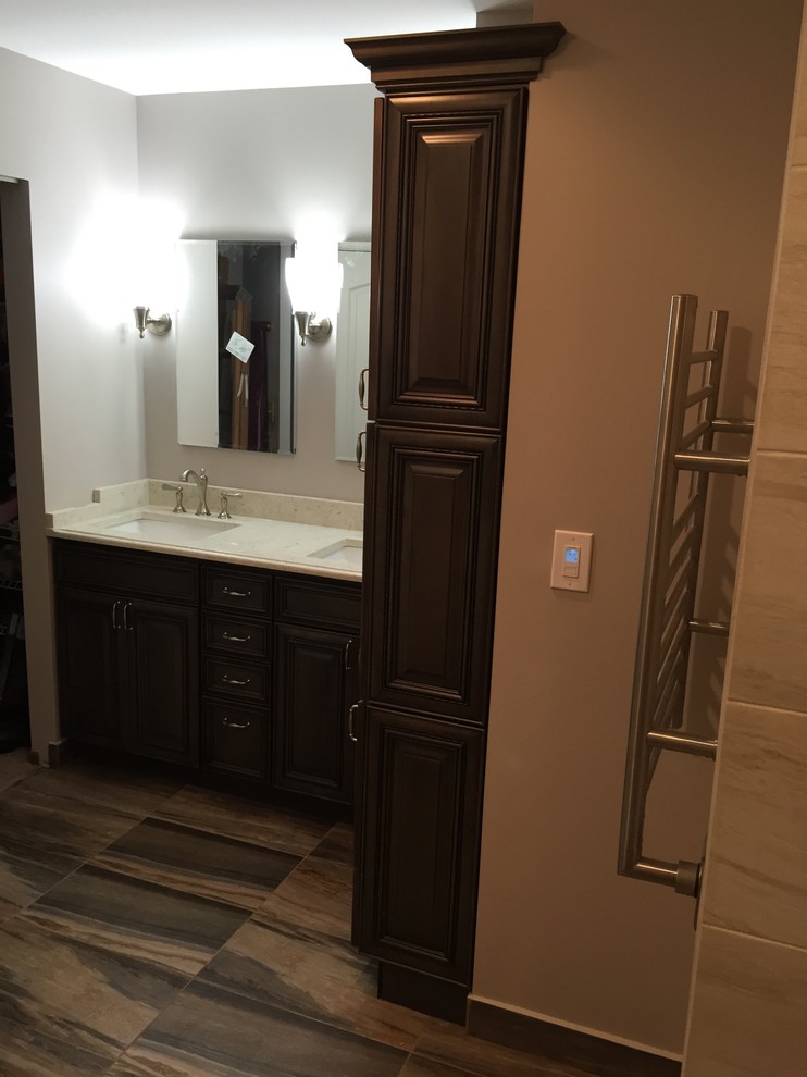Inspiration for a mid-sized transitional master porcelain tile home design remodel in Chicago with raised-panel cabinets, gray cabinets, a two-piece toilet, an undermount sink and quartz countertops