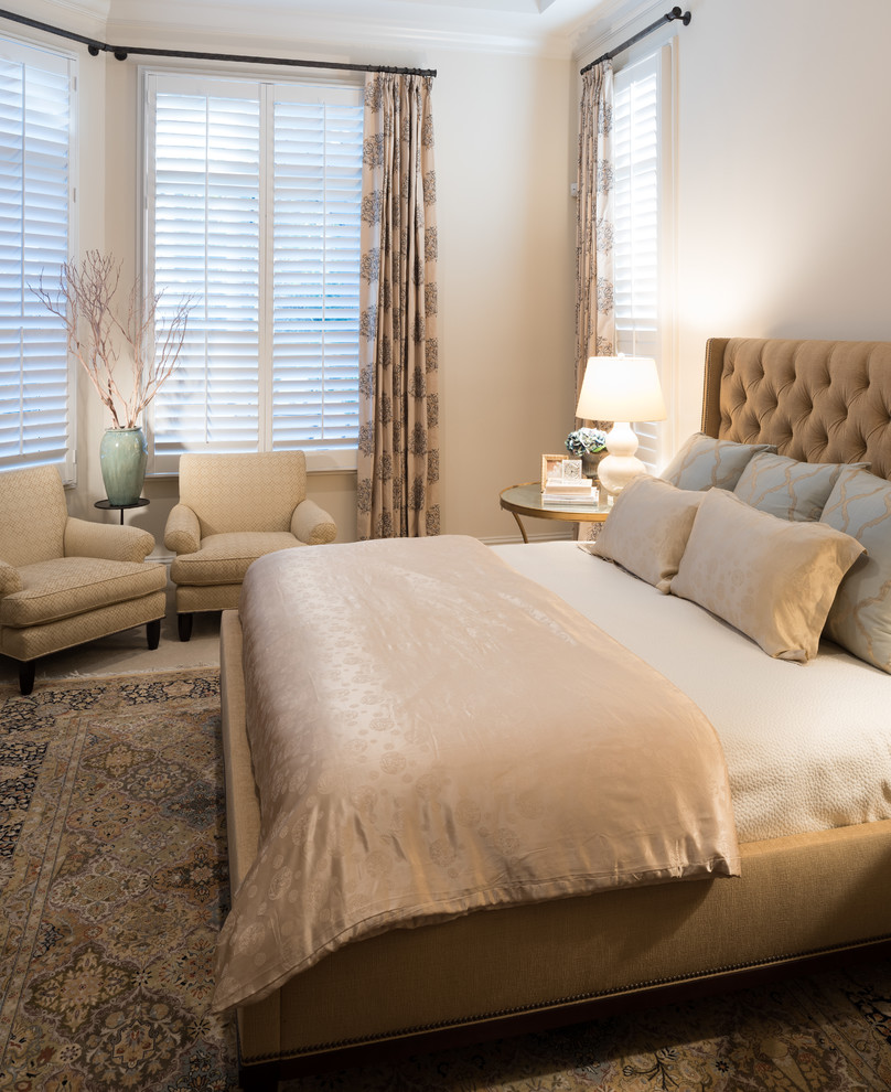 Example of a mid-sized transitional master beige floor bedroom design in Miami with beige walls and no fireplace