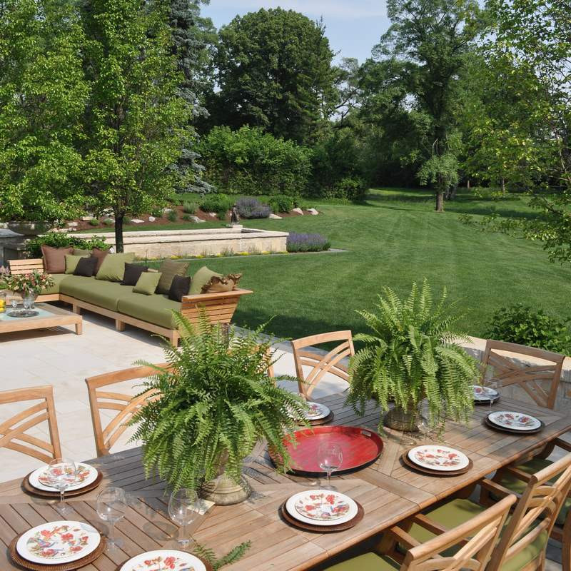 Dining terrace overlooking fountain and open lawn
