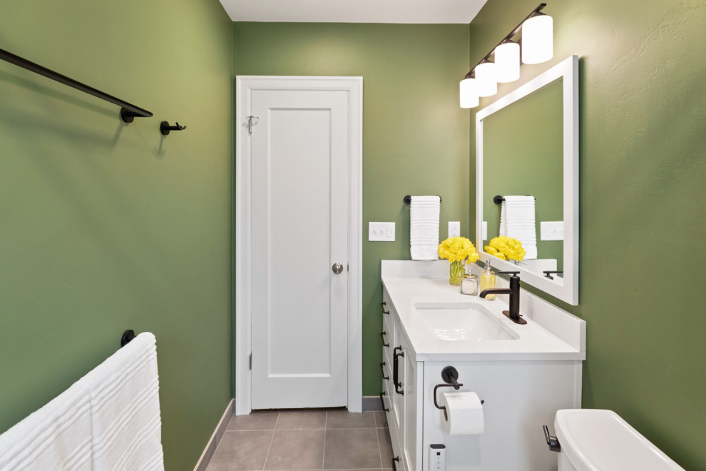 Photo of a small bathroom in Other with white cabinets, an alcove tub, a shower/bathtub combo, a bidet, white tile, ceramic tile, green walls, slate floors, an undermount sink, engineered quartz benchtops, grey floor, a shower curtain, white benchtops, a single vanity and a built-in vanity.