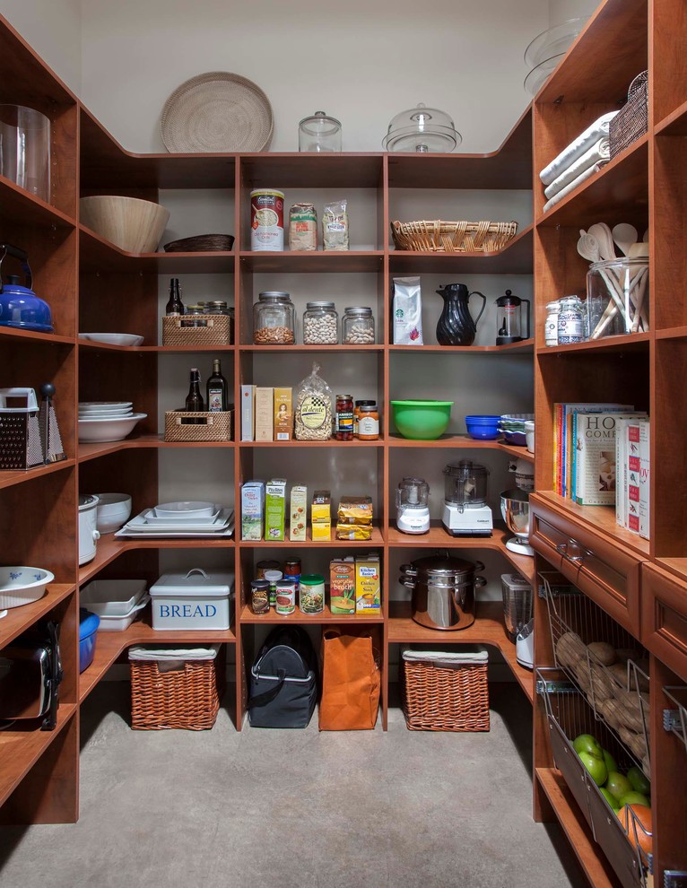 This is an example of a mid-sized traditional kitchen pantry in San Francisco with raised-panel cabinets and medium wood cabinets.