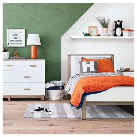 Design ideas for a mid-sized modern kids' bedroom for kids 4-10 years old and boys in Minneapolis with green walls, light hardwood floors and beige floor.