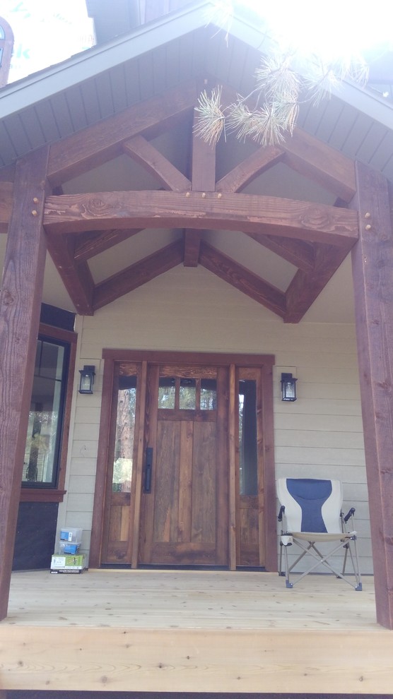 Small mountain style front door photo with a medium wood front door