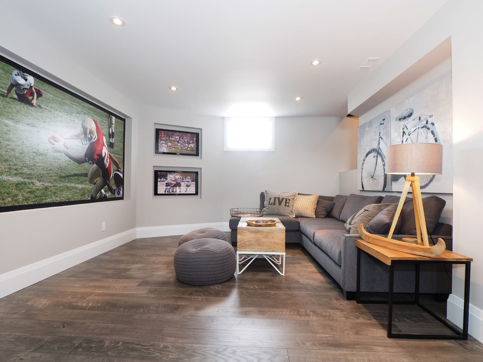 Transitional look-out basement in Toronto with grey walls, no fireplace and dark hardwood floors.