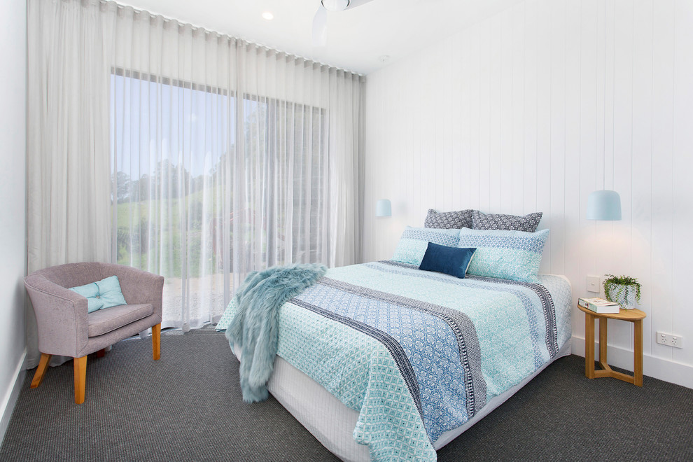 Inspiration for a contemporary guest bedroom in Wollongong with white walls, carpet and grey floor.